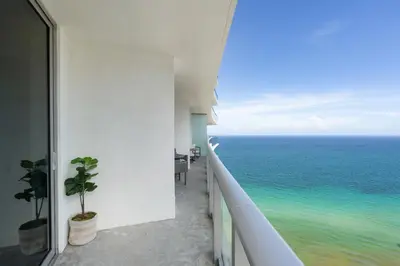 a balcony with a view of the ocean at Picturesque Beachfront Condo - LOVELY 2BD and 2BA APT WITH DIRECT OCEAN VIEW in Hollywood