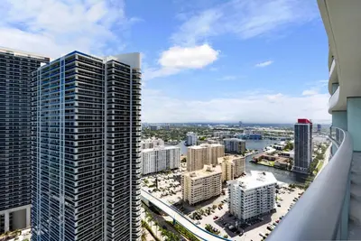 an aerial view of a city with tall buildings at Picturesque Beachfront Condo - LOVELY 2BD and 2BA APT WITH DIRECT OCEAN VIEW in Hollywood