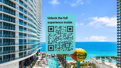 a sign in front of a building next to the ocean at Iconic Ocean View - in this Stunning Condo in Hollywood