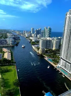 a view of a river in a city with buildings at Oceanfront Studio with Beach Pool & Restaurants 010B in Hallandale Beach