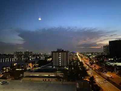 a view of a city skyline at night at Dream Beach Apt 1BR Kitchen & Pool Access 06A in Hallandale Beach