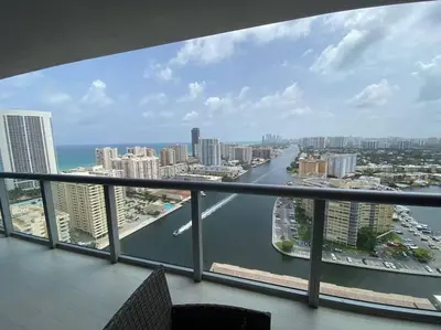 a view of a river from a balcony at Dream Beach Apt 1BR Kitchen & Pool Access 06A in Hallandale Beach