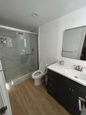 a bathroom with a shower and a toilet and a sink at NEW LUXURY APARTMENT 2Br 2Ba DIRECT BEACH ACCESS in Hollywood Beach