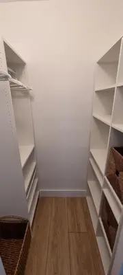 a closet with white shelves and a wooden floor at NEW LUXURY APARTMENT 2Br 2Ba DIRECT BEACH ACCESS in Hollywood Beach