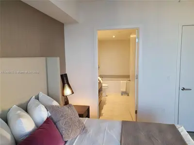 a bedroom with a bed and a room with a bathroom at Lux apartment Hyde Beach House in Hollywood