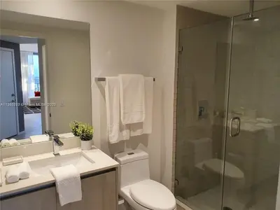 a bathroom with a shower and a toilet and a sink at Lux apartment Hyde Beach House in Hollywood