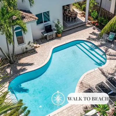 Steps from the Beach Heated Pool Sun Key Game room RESlDENCES
