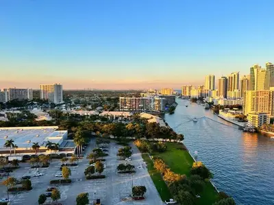 an aerial view of a city with a river and buildings at Modern Beach Apartment, 3 Beds, Views & Full Kitchen in Hallandale Beach