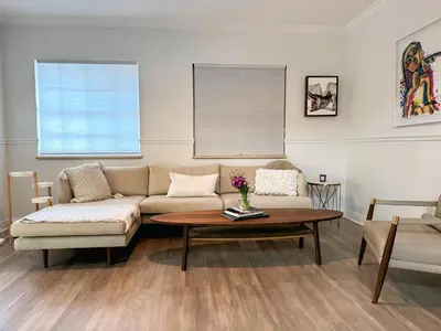 a living room with a couch and a coffee table at Amazing 3-bedroom modern home in Coral Gables area in Miami