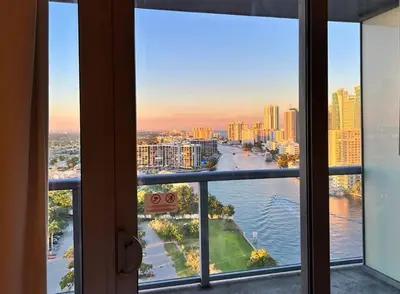 a view of a river from a window at Walk to the Waves, 2 Full Bed Beach Studio Stay in Hallandale Beach