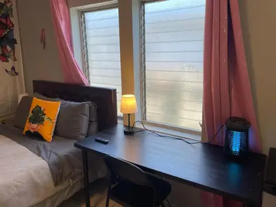 a bedroom with a desk with a bed and a window at Best Value inside City Miami, Near Airport, Beach, Center & Metro in Miami