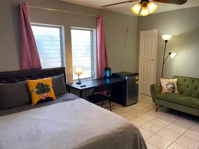 a bedroom with a bed and a desk and a chair at Best Value inside City Miami, Near Airport, Beach, Center & Metro in Miami