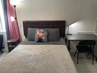 a bed in a room with a desk and a bed sidx sidx sidx at Best Value inside City Miami, Near Airport, Beach, Center & Metro in Miami