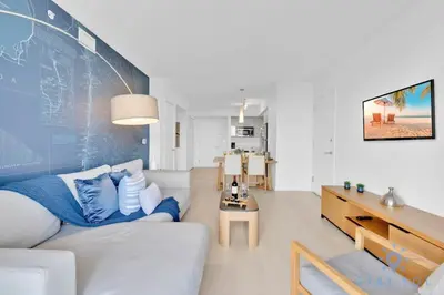 a living room with a couch and a table at Pool - Apartment with Balcony - Gym - Near Beach in Hallandale Beach
